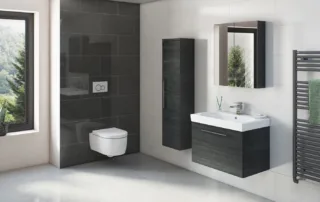 Contemporary bathroom with wall-mounted furniture, black feature tiles, and floating toilet