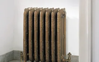 Decorative cast iron radiator in classic Victorian style with floral detailing