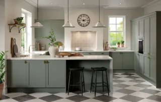 Elegant sage green shaker-style kitchen with island breakfast bar
