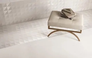 Modern bathroom with white textured porcelain tiles and a bench